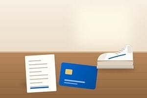 Are shoe lifts covered by insurance: a custom-lifted sneaker next to a blue HSA card and an itemized receipt on a desk