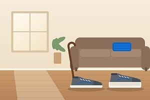 Walking uneven after hip surgery: illustration of walking sneakers, one with a thicker lifted sole, and a cane beside a couch